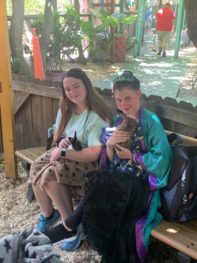 happy young adults with asd eating ice cream